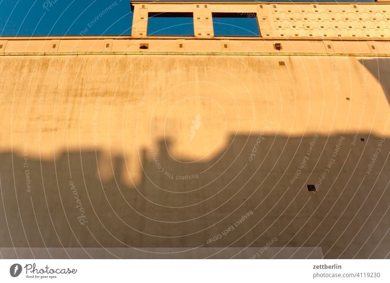 Facade with the shadow of another facade Old building on the outside Fire wall Window House (Residential Structure) Sky Sky blue rear building Backyard