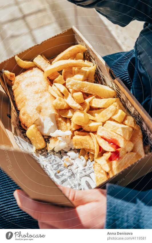 Fish and Chips with peas fish and chips sauce take away food english crispy fillet dinner british fried street food outside covid lockdown local altrincham