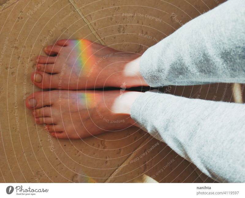 High angle view of a rainbow reflected over feet magical equality diversity prism reflection real real people point of view ligth sunligth feel feelings touch