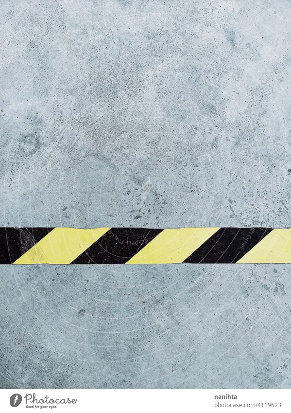 Grunge background with a line what is a sign of caution danger mark warning signal aslphalt road parking grunge urban zone equipment garage maintenance black