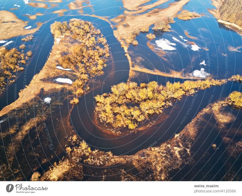 Spring melting river flood aerial panorama. Overflow water at springtime. overflow deluge inundation floodwaters spate alluvion view environment beautiful