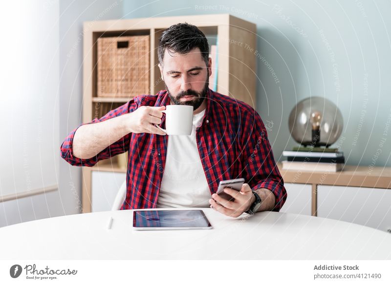 Young man working from home graphic business technology modern young interior internet job workplace table freelance male house room icon workspace hipster