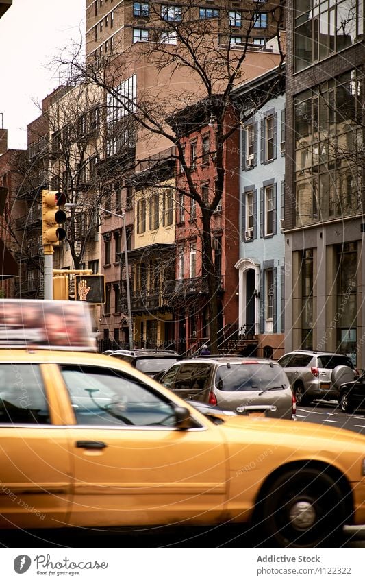 Old city street with traffic building road car old crossroad district taxi typical stone new york usa america crosswalk cab architecture cityscape travel