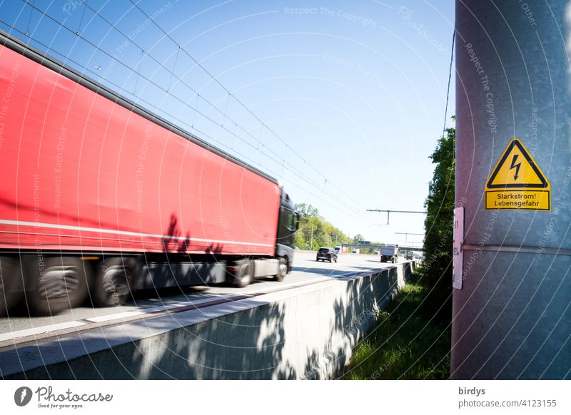 E-highway, test track with overhead line on the A5 for e-trucks . E-trucks can charge their batteries with electricity while driving E-TRUCK Overhead line