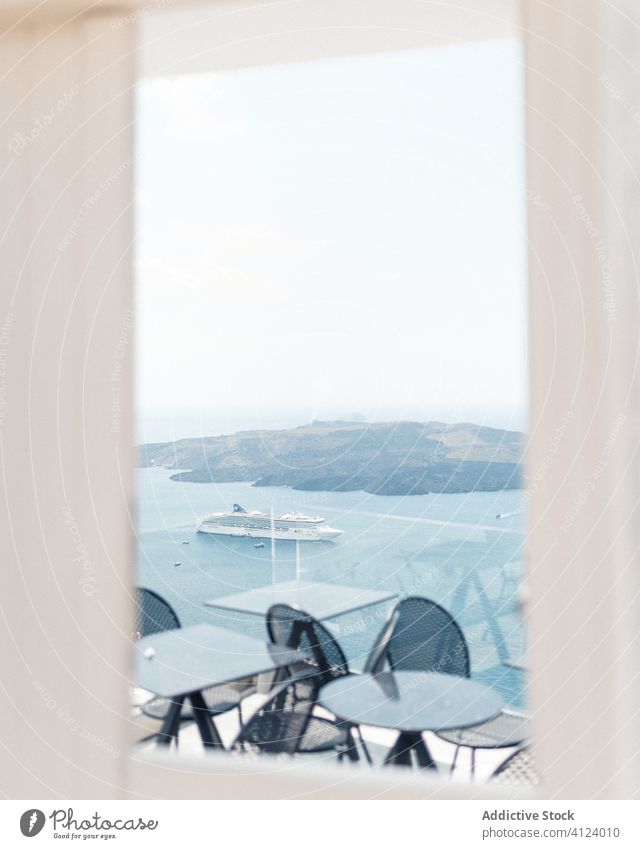 Terrace with amazing view of sea terrace landscape window table chair cruise ship blue sky greece santorini picturesque travel clear island summer nature trip