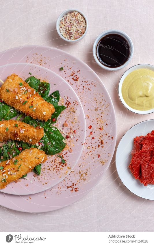 Battered chicken skewers in fried panko on restaurant table breaded food crispy snack meal golden appetizer dinner crunchy gourmet coated delicious cooked hot