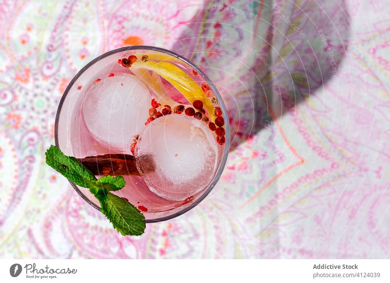 Gin tonic cocktail with pink tonic water gin tonic alcohol ice drink lemon beverage glass cold Pub bar liquid Tonic fruit alcoholic liquor green orange