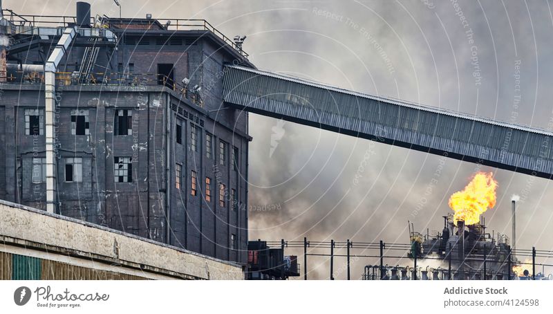 Exterior of coking plant with pipes and coke batteries coke battery industrial smoke factory flame building weathered aviles spain industry manufacture