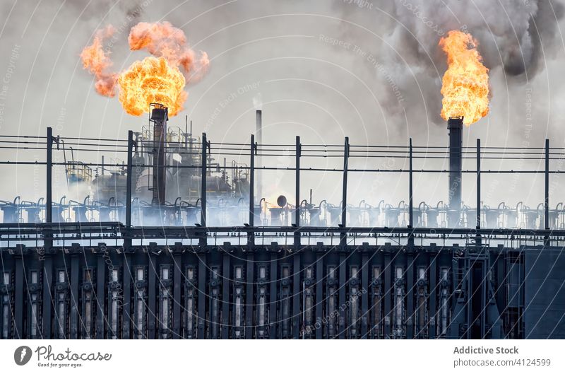 Exterior of coking plant with pipes and coke batteries coke battery industrial smoke factory flame building weathered aviles spain industry manufacture