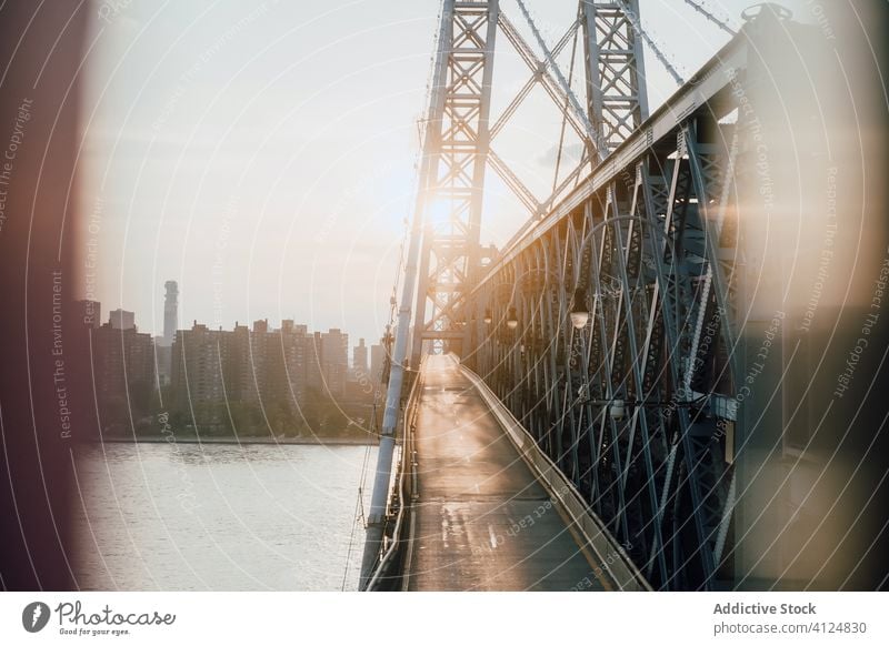 Modern bridge over river in morning city pedestrian pathway cityscape urban modern empty contemporary construction water downtown neighborhood uptown