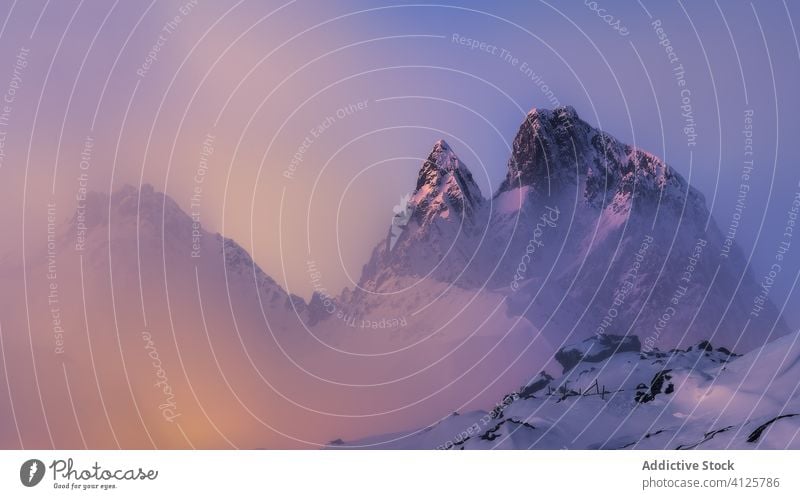 Peaks of high snowy mountains at sunset landscape peace night breathtaking spectacular idyllic harmony nature scenery picturesque untouched tranquil ridge