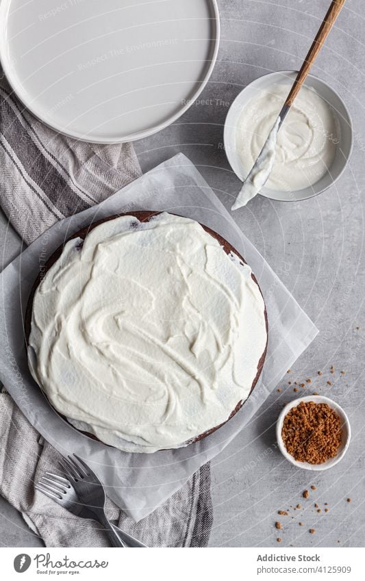 Tasty chocolate cake with cream on plate on table kitchen homemade tasty dessert food treat gourmet fresh bakery pastry sweet cook cuisine decorate baked recipe