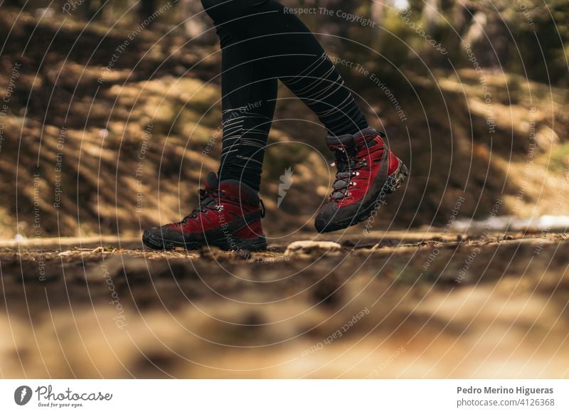 side view of hiking boots walking in the mountain travel snowy nature copy space trekking footwear adventure hike shoe tourism lifestyle activity outdoor trail