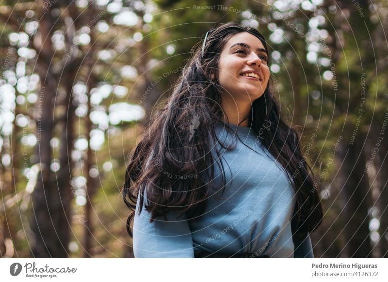 Portrait of a female hiker walking in a forest. mountain travel landscape nature copy space woman hiking adventure people tourist backpack tourism young