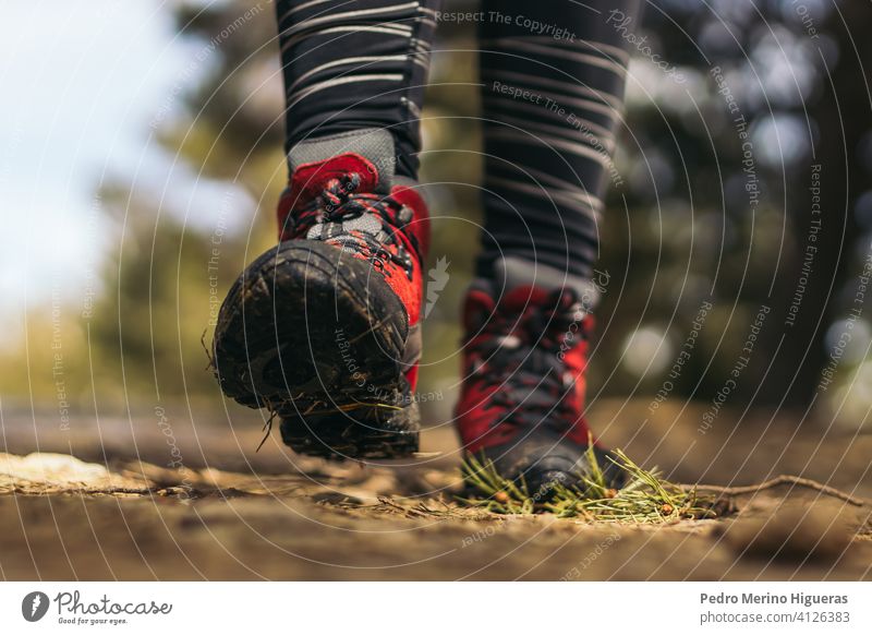 Close- up of hiking boots walking in the mountain travel nature copy space adventure trekking hiker shoe healthy lifestyle summer active exercise people foot