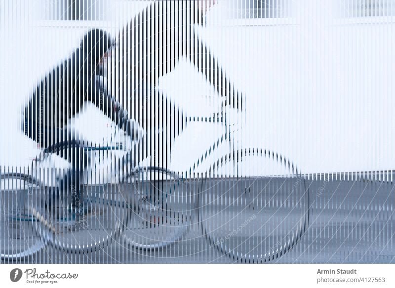 stripes image, movement of a cyclist with black jacket on white background bike bicycle look cropped speed double exposure outdoors wall street road tire sport