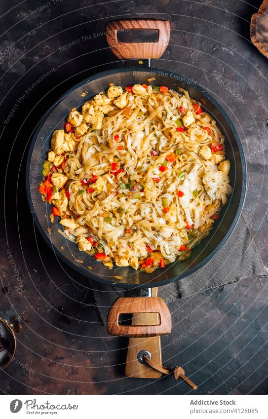 Delicious stir fry noodles in pan food chicken homemade eat serve spicy dish cook vegetable mix delicacy authentic menu aromatic tradition tasty dinner lunch