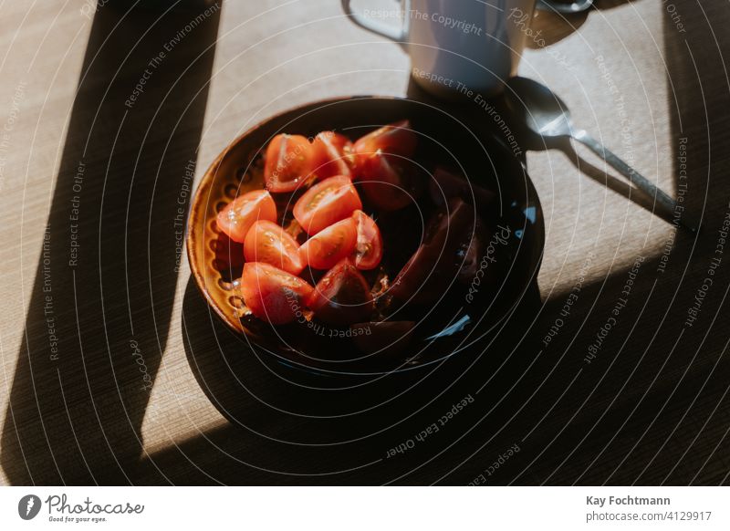 photo of cut tomatoes on a plate appetizer closeup delicious food fresh freshness healthy home indoor lunch meal nourishment nutrition prepare red salad shadow