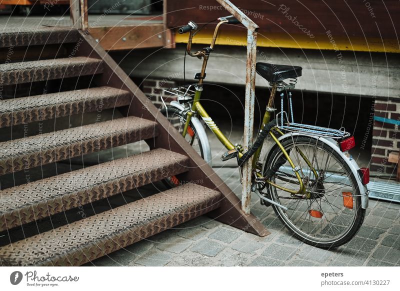 Green bicycle in an industrial warehouse district in Hamburg Germany bike brick wall commute dirty gray grey industrial style pretty transport transportation