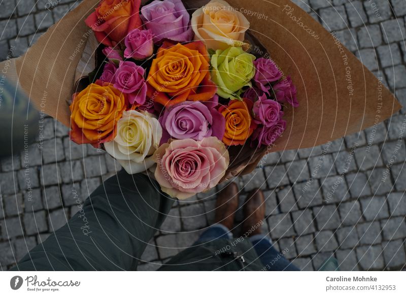 Woman holding colorful bouquet of roses in hand flowers Mother's Day variegated Bouquet Spring Flower Nature pretty Green Plant Pink Floral Decoration naturally