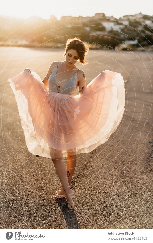 Happy woman dancing on street dancer happy delight artist elegant grace cheerful young sunset female summer smile joy optimist laugh excited move glad positive