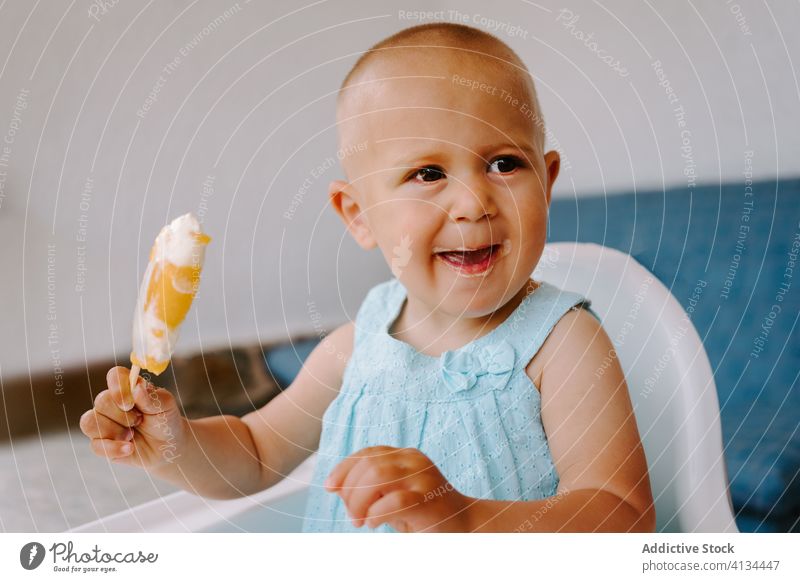 Adorable girl with mold of homemade ice lollies eat popsicle toddler ice cream summer adorable delicious treat terrace kid little child childhood relax female