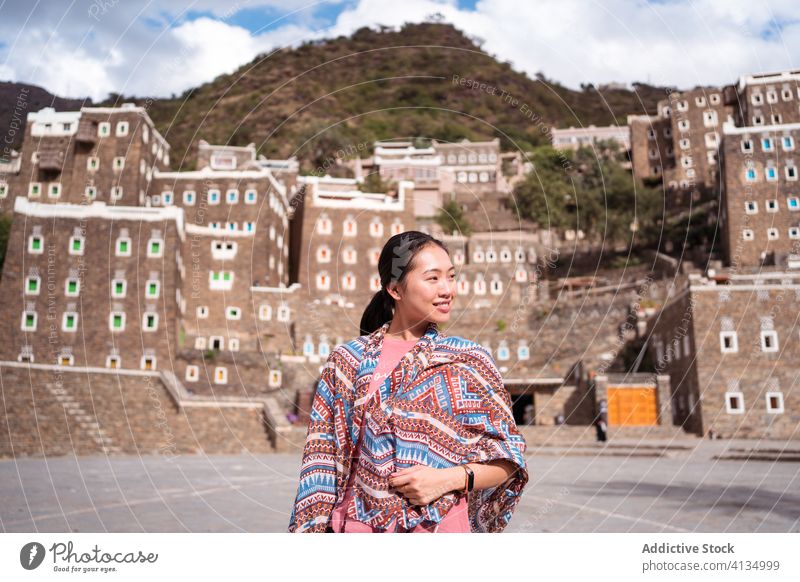 Traveling woman in Rijal Almaa village rijal almaa travel vacation destination saudi arabia summer chinese tourism architecture building window colorful stone