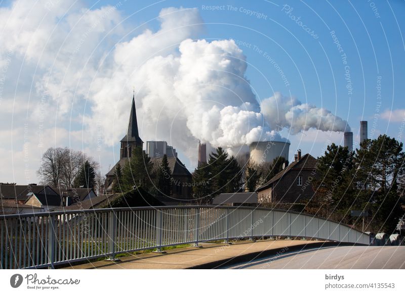 Niederaußem power station, village with church in front of a lignite-fired power station in the Rhineland Place Lignite power plant Environmental pollution co2