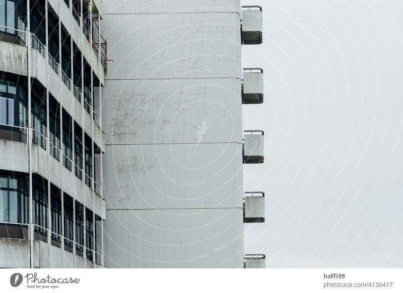 drab grey concrete facade with balconies Balcony dreariness Modern Facade City structure urban Building Balconies High-rise Apartment Exterior shot Design