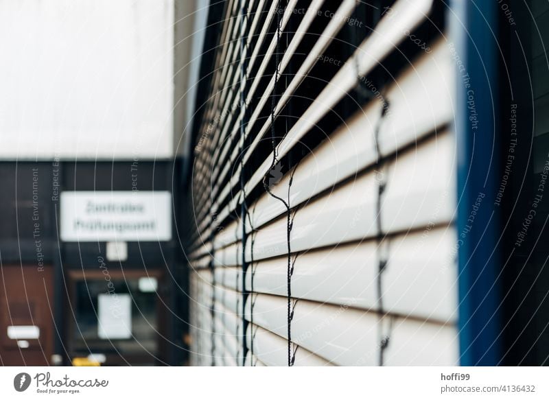 closed blinds in front of the examination office university Examinations and Tests Examination Office Venetian blinds Closed University & College student