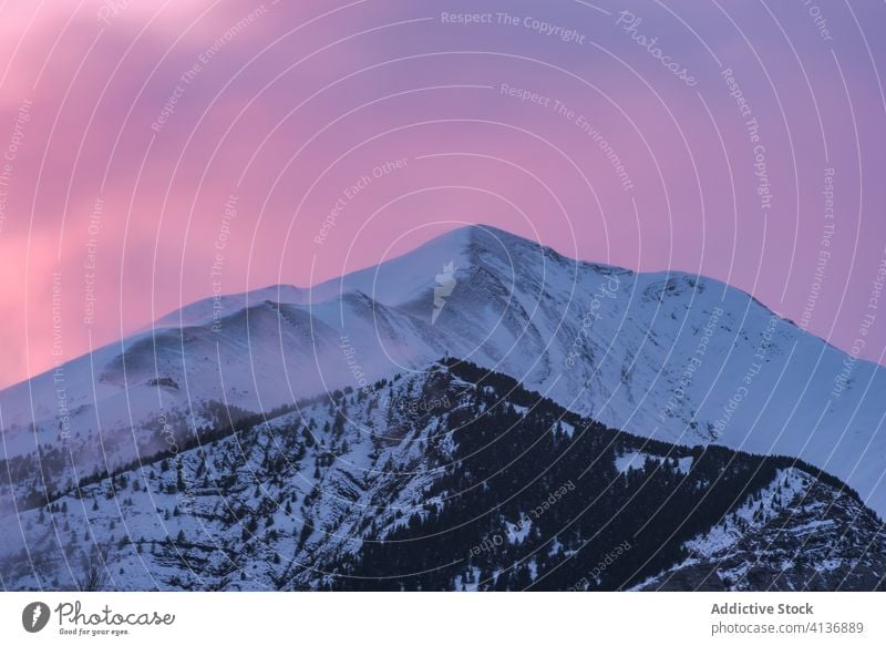 Mountain covered with snow at sunset in winter mountain landscape breathtaking spectacular idyllic nature scenery fog picturesque untouched tranquil ridge