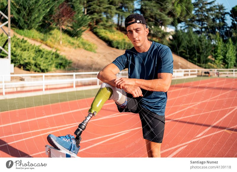 Athlete with leg prosthesis portrait athlete boy young man runner running sport prosthetic disability disabled amputation amputee sports sports wear