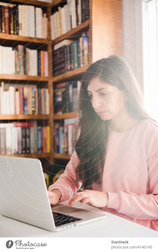 Young woman working on white marble desk at her home. young person hand table female soft library wooden pen business top background morning girl adult