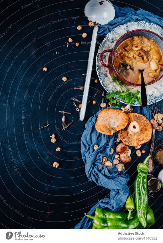 Mushroom soup and green pepper on table mushroom dinner serve red pine mushroom chili savory spicy delicious ingredient bowl meal food dish cuisine tasty