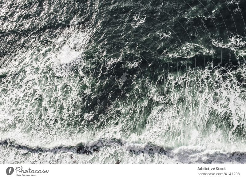 Majestic waves of powerful ocean crash storm background water ireland coast shore wild remote foam scenic dark seascape dash tide splash cliff seashore abstract