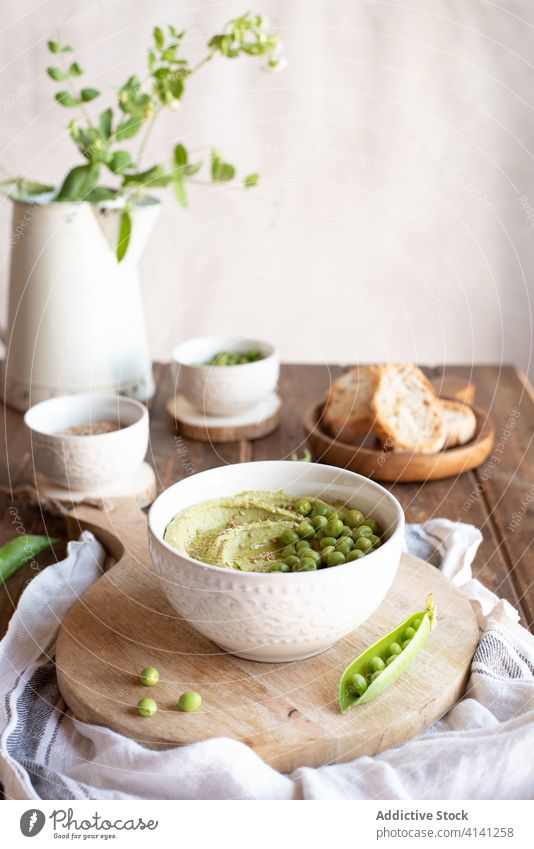 Hummus with green pea and bread hummus food natural tasty appetizer starter serve ingredient cook fresh nutrition healthy delicious cuisine meal homemade