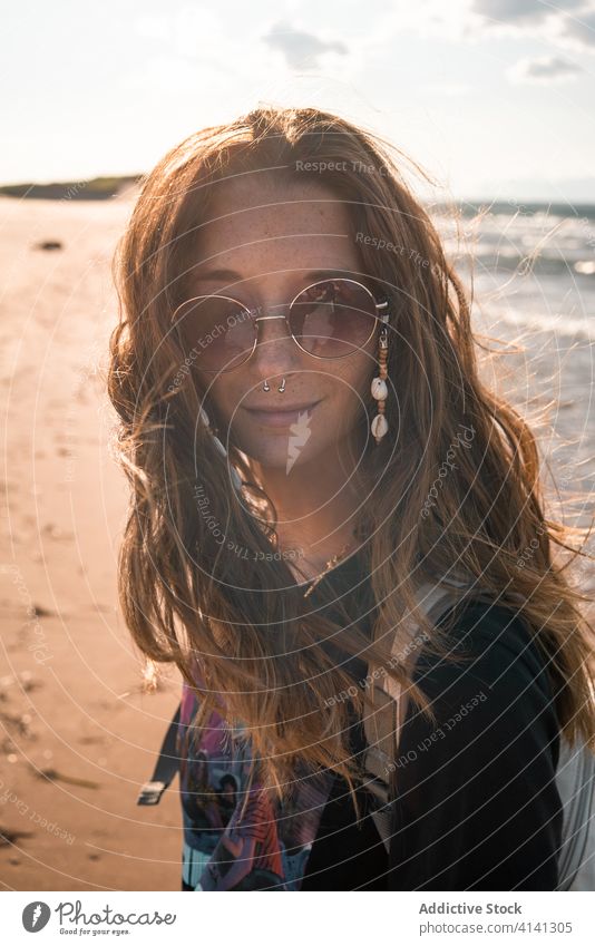 Tranquil woman at seaside in sunset hippie beach calm tranquil travel evening female ocean summer relax coast vacation water peaceful shore scenic nature