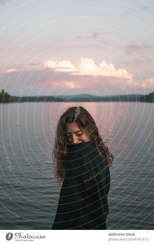 Content woman near lake in Canada sunset traveler enjoy algonquin provincial park amazing sundown holiday serene canada female sky twilight dusk nature evening