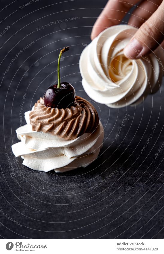 Woman with sweet Pavlova meringues pavlova dessert garnish cherry chocolate woman cream fresh female delicious tasty table gourmet yummy nutrition food treat