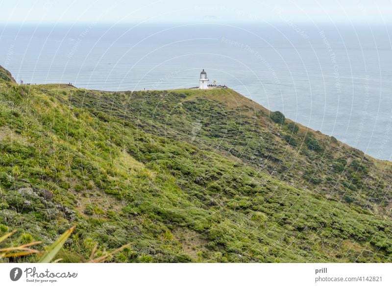 lighthouse at Cape Reinga cape reinga te rerenga wairua aupori peninsula north island new zealand coast coastal sea ocean landscape tasman sea pacific ocean