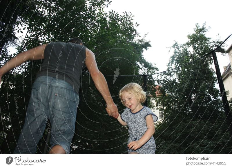 Father holds daughter Daughter Child Family & Relations dad Parents Love parenthood Parenting Trust Paternity Responsibility Girl Playing Happy Man children fun