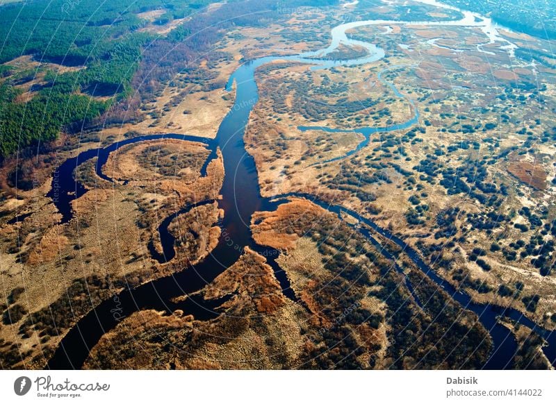 Overflowing river in the valley, aerial view nature steppe landscape texture field green pattern stream terrain drone amazing scenery water environment blue