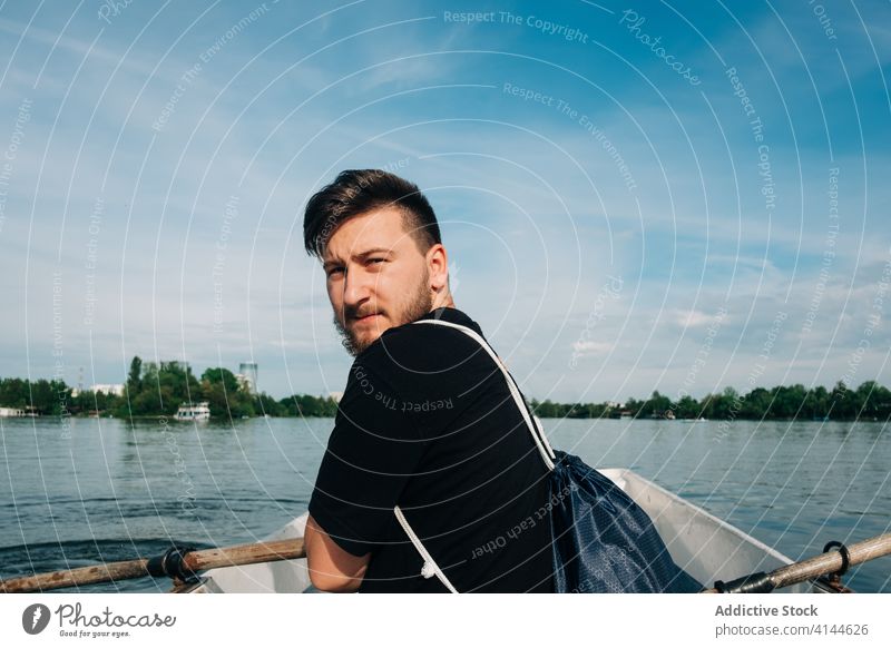 Man rowing boat on peaceful pond man lake positive oar nature activity content picturesque calm relax summer leisure saint george transylvania romania quiet