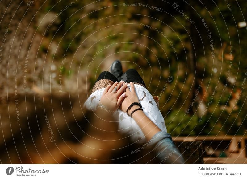 Anonymous woman relaxing on rooftop on sunny day building old amazing landscape admire edge rest female ethnic african american black curly hair enjoy journey