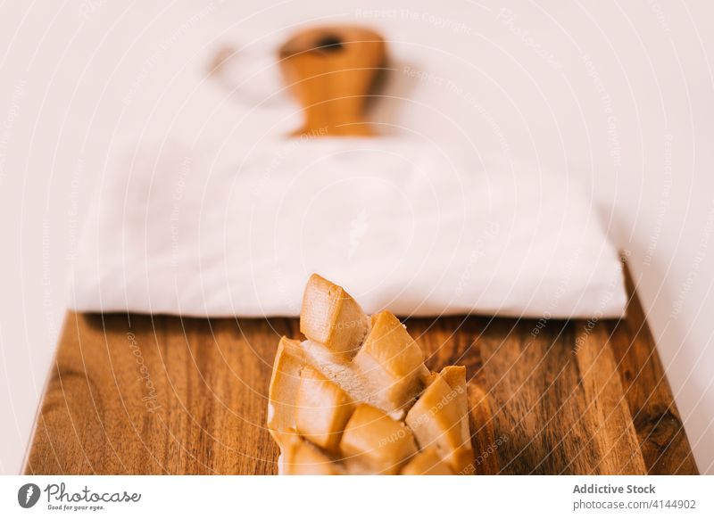 Bread served on top of a cutting board bread bun food fresh piece breakfast delicious meal tasty morning nutrition snack slice cuisine yummy baked lunch