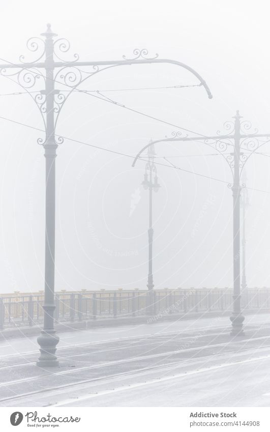 Empty road on misty day fog morning city empty gloomy pillar cable roadway metal fence old weathered amazing haze tranquil magnificent peaceful calm wonderful