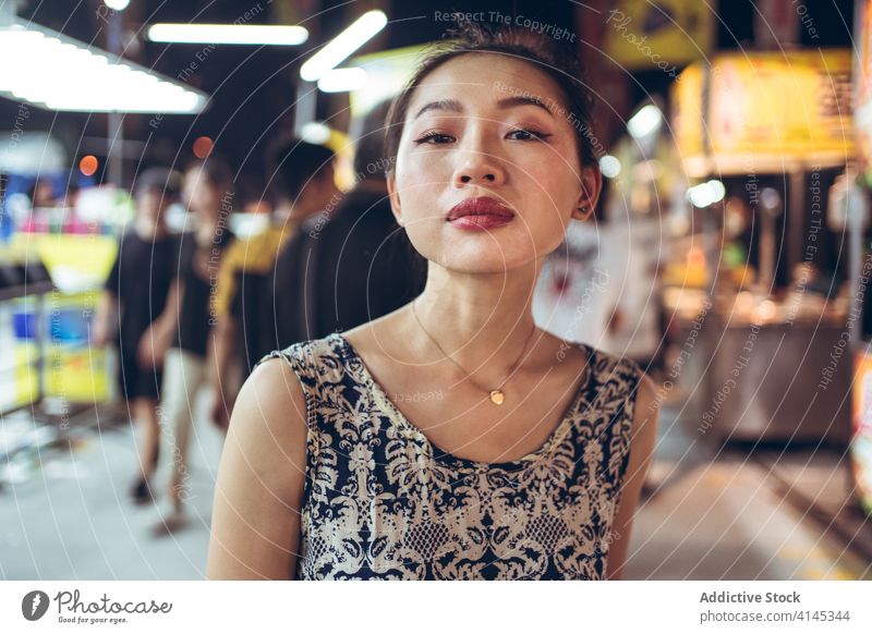 Asian woman in Zhubei Night Market night market zhubei night market street evening crowd stroll city weekend female asian ethnic taiwan confident urban counter