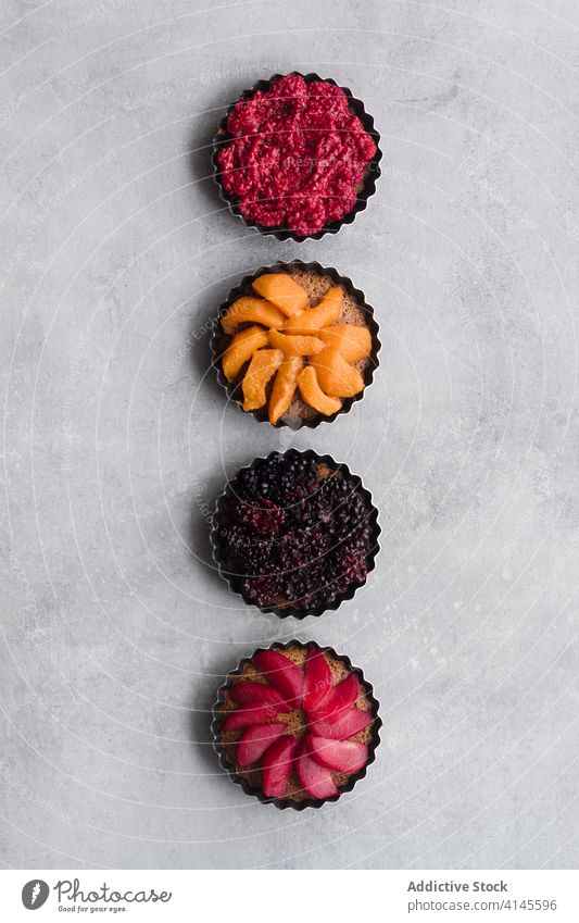 Fruit cakes in row on table fruit pie berry assorted various delicious bakery ripe palatable line fresh food raspberry blackberry dessert sweet organic