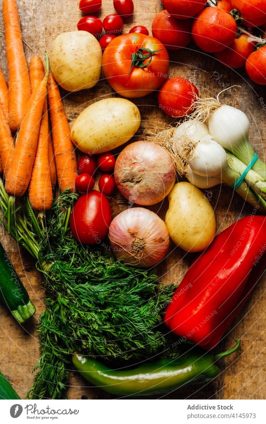 Bunch of assorted fresh vegetables on table various tomato carrot onion potato lettuce cauliflower green food organic healthy natural nutrition vitamin