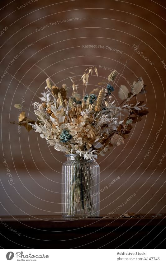 Bouquet of flowers in vase bunch bouquet dried floor plant concrete glass various assorted dry elegant design natural floral composition fragile arrangement